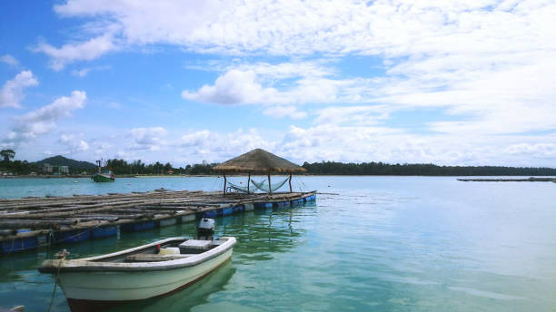 istock blue lake and the white boat under the cloudy sky 1435911240