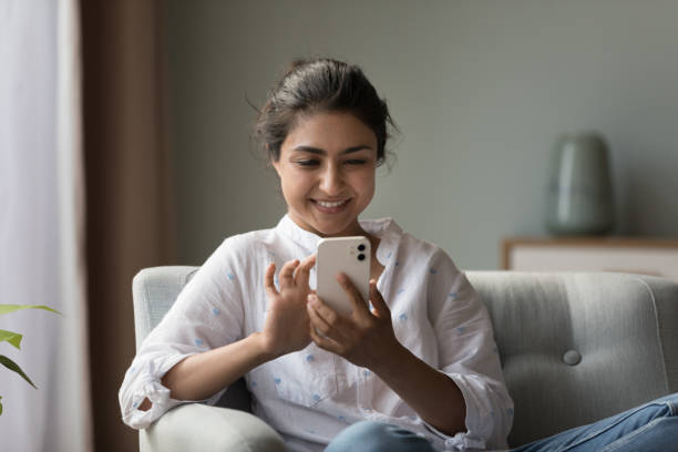 istock Indian woman websurfing information using modern cellphone 1435911278