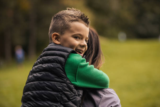 istock Beautiful young boy having fun with his mother 1435915101