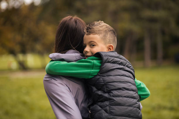 istock Young boy piggybacking on his mothers back 1435915539