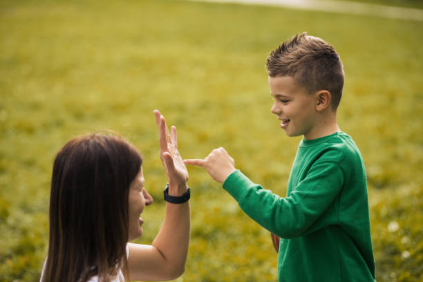 istock Young mom and son spending quality time together in a park 1435915816
