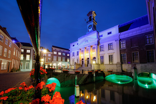 old city hall in the center of the city dordrecht at night, blue hour