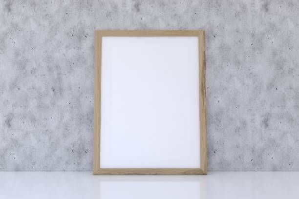 istock 3D rendering of a mockup frame near a gray wall 1435923850