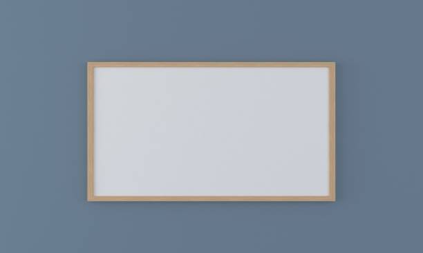 istock 3D rendering of a mockup frame near a blue wall 1435924948