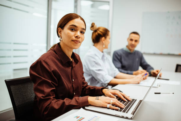 istock Multi ethnic business team in office, employee looking at camera 1435930490