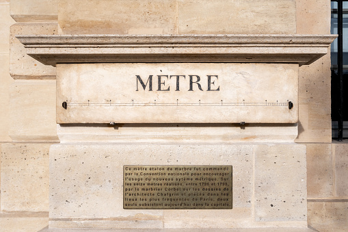 Paris, France - October 23, 2022: Official engraved marble standard meter, set up Place Vendome in Paris during the French Revolution to introduce the metric system to France