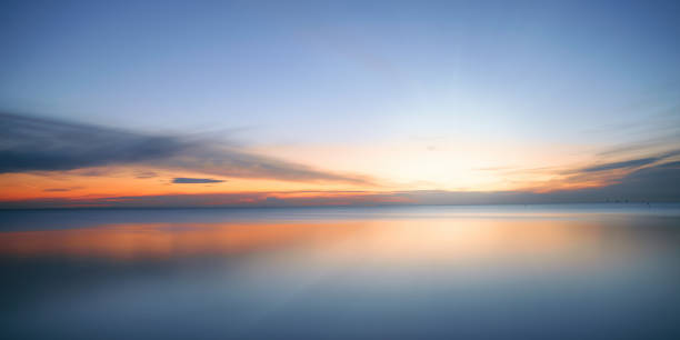 istock Calm colored sea and sky at sunset 1435936915