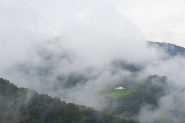 Cloudy and rainy day in the house between the mountains
