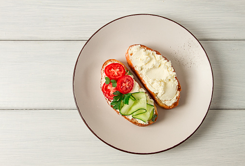 Sandwich, with cream cheese, homemade, on a cutting board, rustic style, no people, selective focus, breakfast