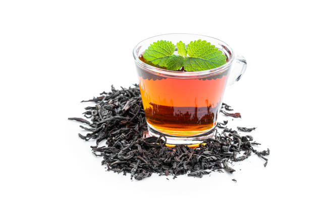 istock Black tea in glass cup isolated on white 1435938642