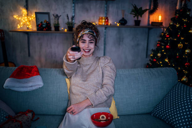 istock Woman watching tv at home 1435938793
