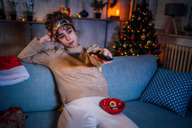 istock Woman watching tv at home 1435939355