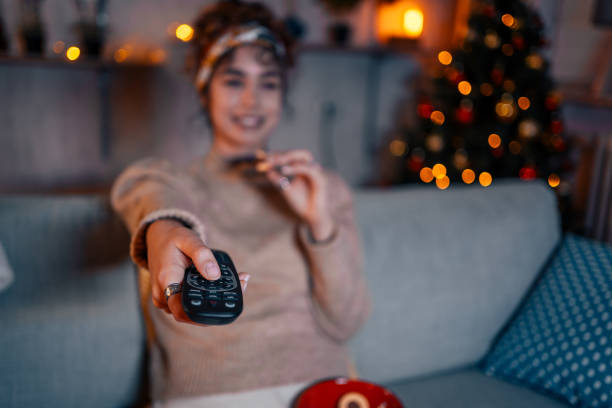 istock Woman watching tv at home 1435939382