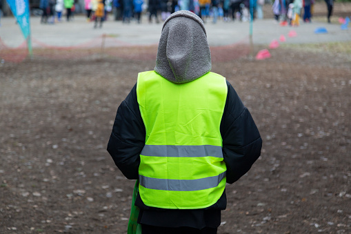 Syktyvkar, Komi, Russia, October 16, 2022,Yellow reflective special vest on a person.Special clothing.