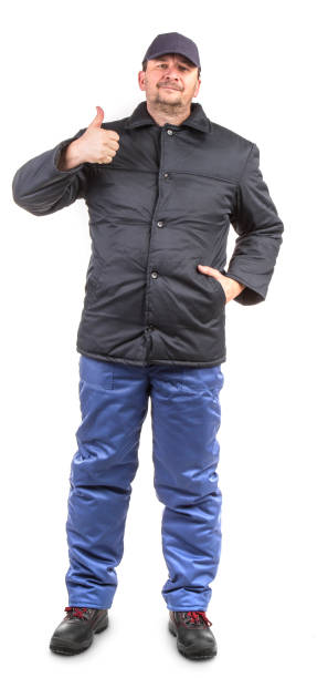 istock A worker in a warm jumpsuit gives a thumbs up. 1435944338