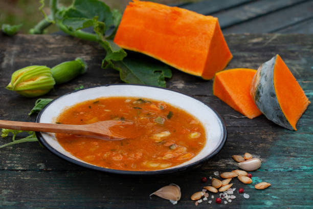 Butternut Squash soup with cream and mushrooms. Hot healthy pumpkin soup in a plate. Homemade autumn food.