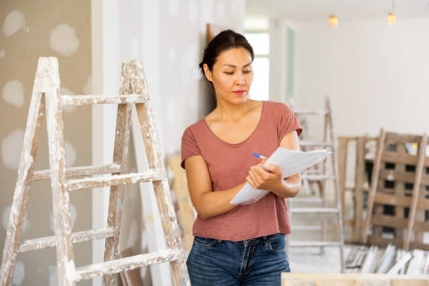 istock Female engineer matching check list during repair works 1435949391