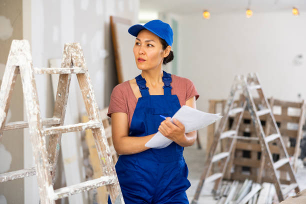 istock Female engineer matching check list during repair works 1435949400