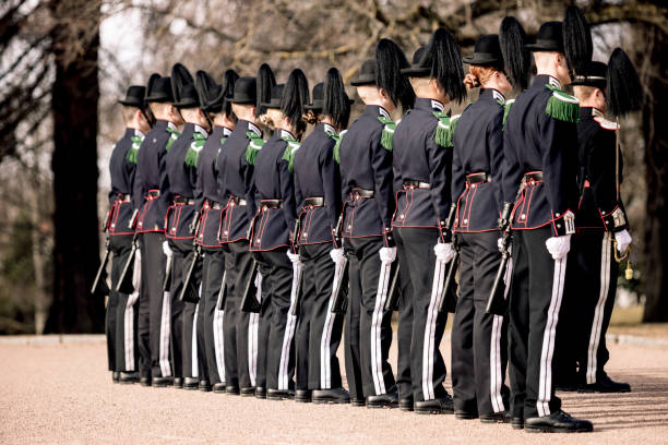 Copenhagen, Denmark - July 29, 2015: The guards of honour march along the square near the Royal residence Amalienborg Palace in Copenhagen.