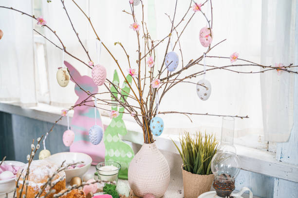 istock Table decoration for Easter celebration in kitchen.Tablescape for Easter holiday at home.Family religious traditional festive christianity,catholic meal food.Pop color eggs,cake,fun bunny,candy sweet 1435949615