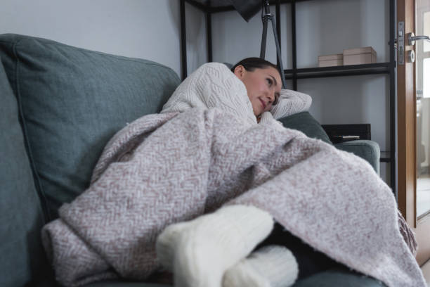 istock Young woman keep warm at home 1435952228
