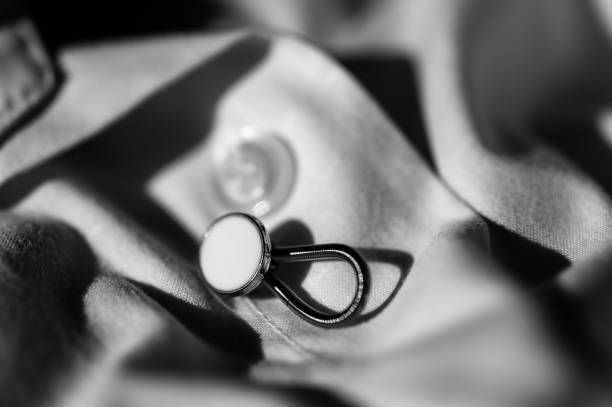 istock button extender shown on a white dress shirt to increase size 1435978265