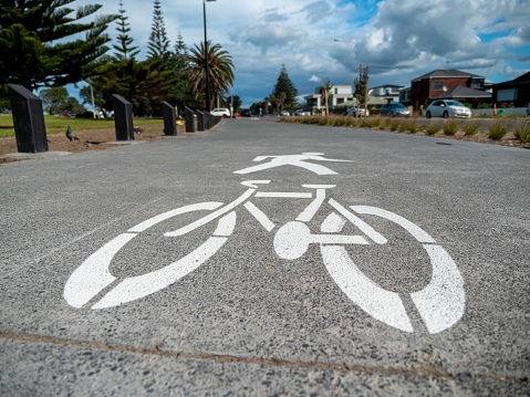 Bicycle and pedestrian lane sign on ground