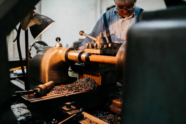 istock Mature man works on a machine 1435981250
