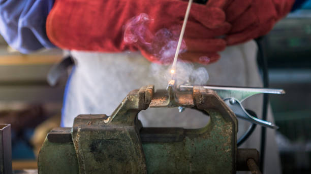 istock A man welder with safety helmet working with arc welding machine in the workshop 1435981989