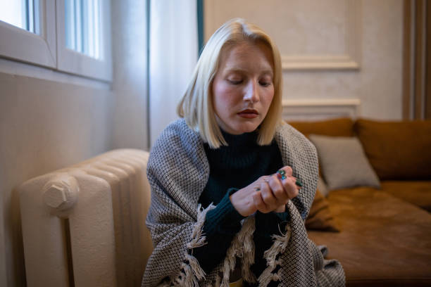 istock Woman feel cold in home with no heating 1435993861