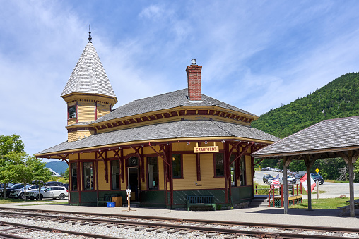Carroll, NH USA - August 3, 2022: Crawford Depot (1891) a historic passenger railroad station at Crawford Notch, near Bretton Woods in the White Mountains of NH. Queen Anne style railroad architecture, operated by the Appalachian Mountain Club (AMC) and part of the service of the Conway Scenic Railroad