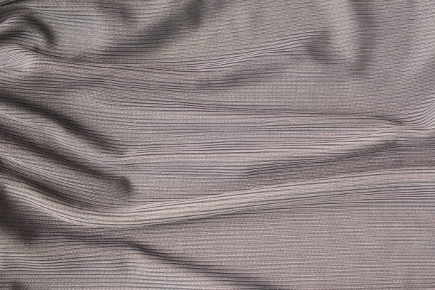 istock Gray crumpled fabric for creative background. Copy space. Vivid textile for wallpaper or design 1435994795