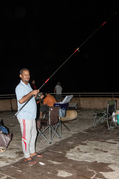 jeddah fishermen at the corniche by the red sea - fishers of men flash imagens e fotografias de stock