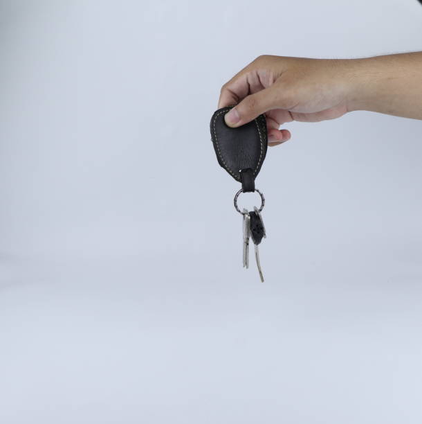 istock hand holding a bunch of keys on a white background 1436000269