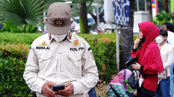 Jakarta, Indonesia - October 16,2022: the uniform of Satpol PP or Polisi Pamong Praja is Indonesian civil service police