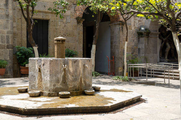 istock fountain inside old stone house surrounded by greenery, central courtyard, latin america 1436009211