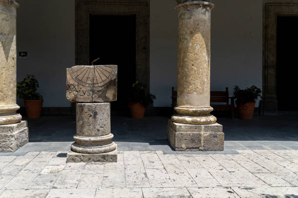greek columns and a sundial inside a building, mexico guadalajara greek columns and a sundial inside a building, mexico guadalajara latin america ancient sundial stock pictures, royalty-free photos & images