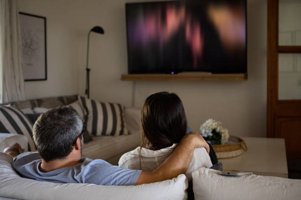 istock Argentinean couple watching TV at home 1436010549