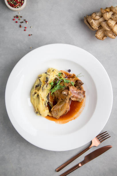 istock Roast beef Dish and white plate on a grey background, Sliced grilled wagyu steak served 1436017147