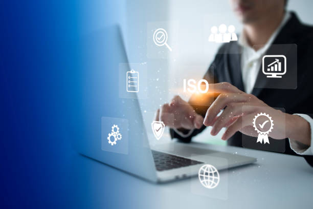 istock ISO Certification of standards quality control assurance business technology concept. Businessman touching virtual screen iso certification icon to guarantee. 1436021111