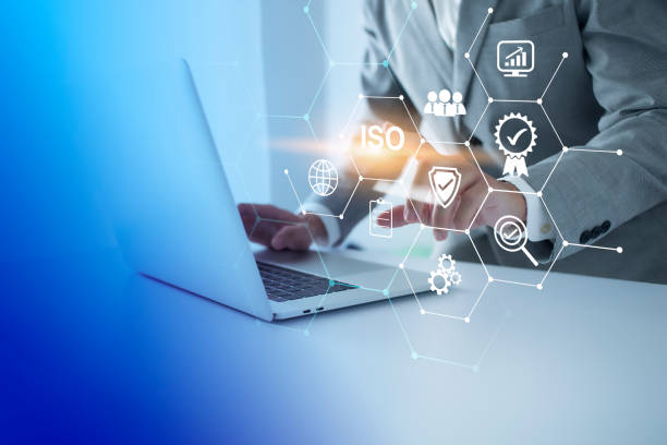 istock ISO Certification of standards quality control assurance business technology concept. Businessman touching virtual screen iso certification icon to guarantee. 1436021115