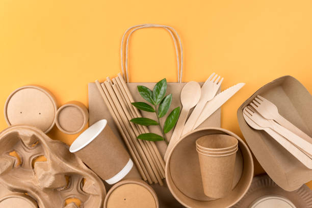 istock Eco-friendly tableware bundle over orange background - sustainable paper food packaging. Street food paper packaging, recyclable paperware, zero waste packaging concept 1436025073