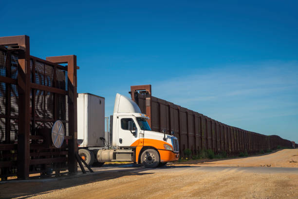 Semi-truck awaiting inspection at the US-Mexico border crossing stock photo