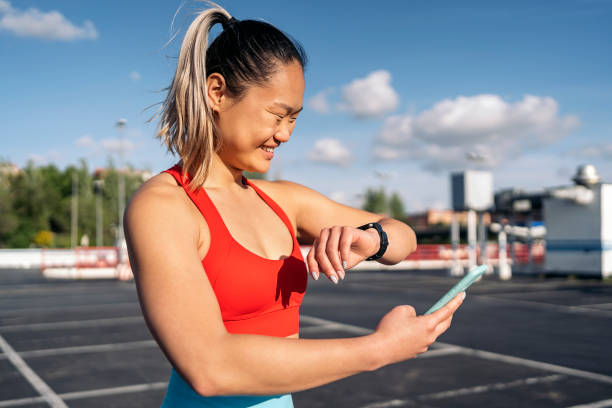 istock Fitness Woman Using Smart-Watch 1436026206