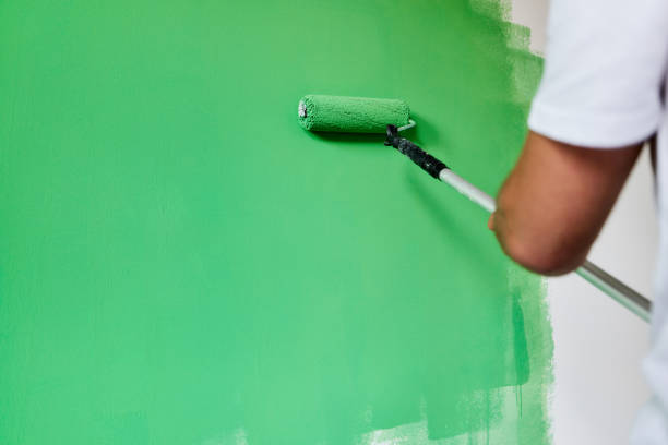 istock Painting the wall in green! 1436029972