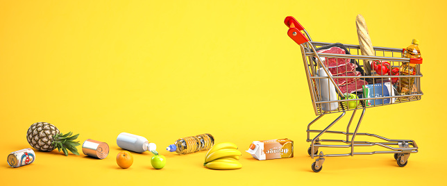 Shopping cart and shopping bags on a black background. Copy space