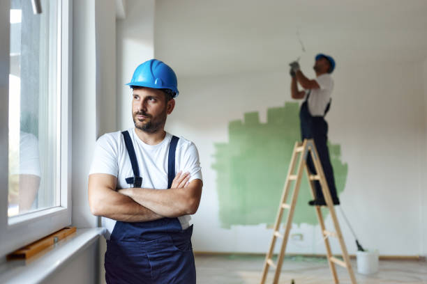 istock Pensive worker with crossed arms during home renovation. 1436031029