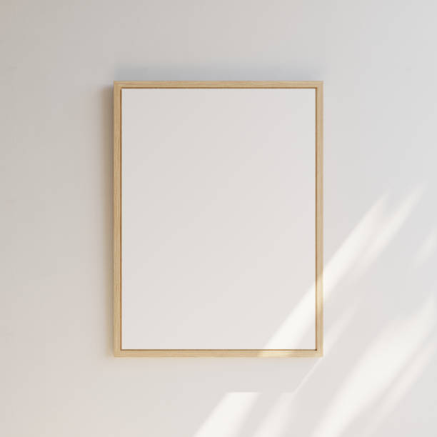 istock White blank notice boards with wooden frame on white wall. Partially lit by sunshine. Template for your content. 3D illustration. 1436031058