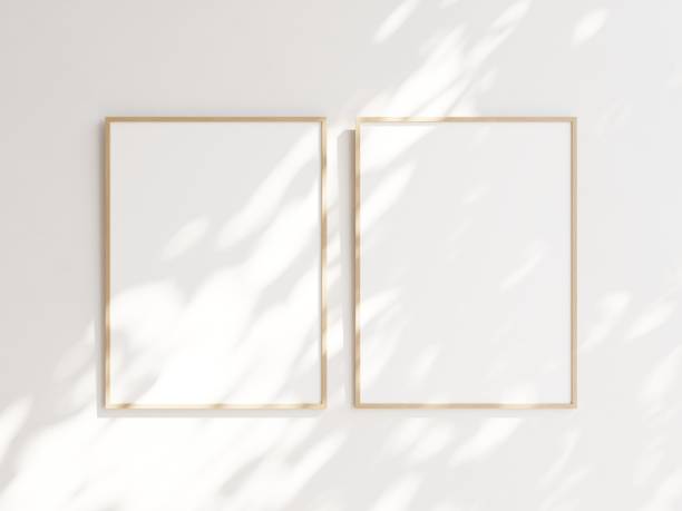 istock Pair of empty wooden picture frames hanging on white wall side by side. Template for your content. 3D illustration. 1436031069