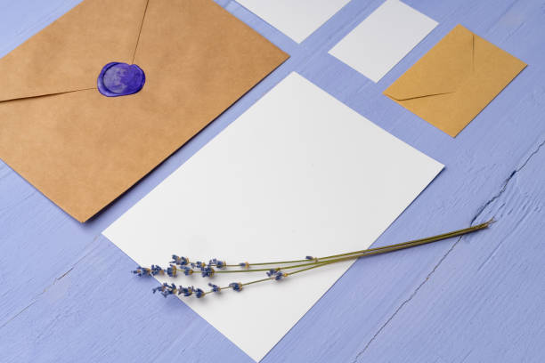 istock Letter envelope on lavender wooden background, copy space 1436031184